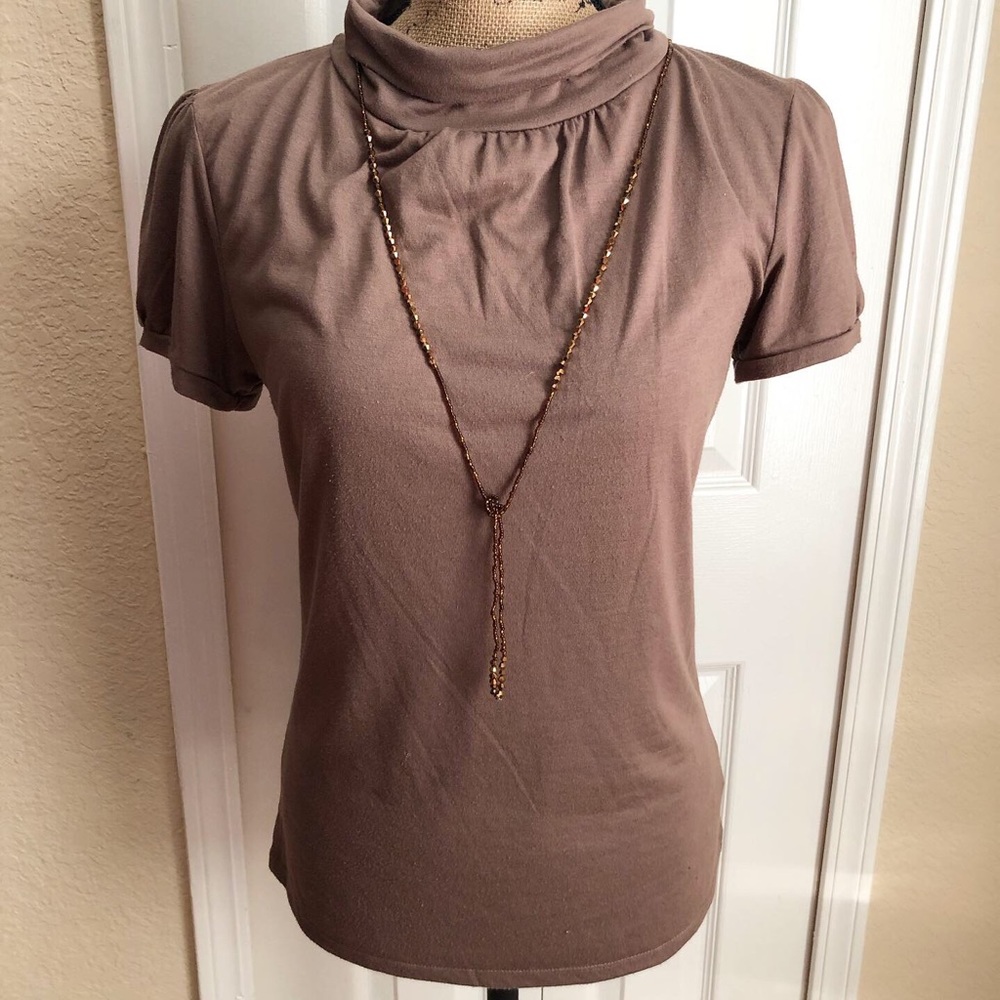 Taupe color top.